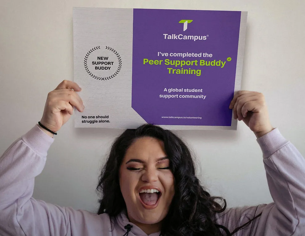 Student celebrating with Peer Support Buddy Training certificate from TalkCampus